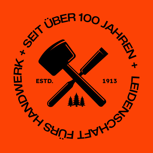 Badge der Werner Ettwein GmbH mit gekreuztem Hammer und Meißel und dem Schriftzug „Seit über 100 Jahren – Leidenschaft fürs Handwerk“